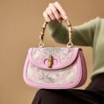Song-Brocade-Pink-Mulberry-Silk-Handbag-Bamboo-Handle-Model-Seated