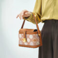 model-holding-zhuang-brocade-bag-single-hand