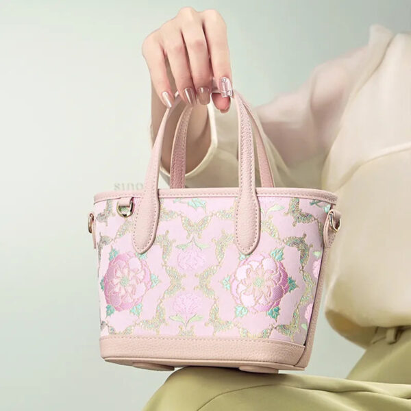 model-seated-carrying-brocade-bag-on-knees model-seated-carrying-brocade-bag-on-knees