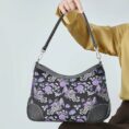 shu-brocade-shoulder-bag-classic-phoenix-peony-motif-model-sitting-knee-handheld